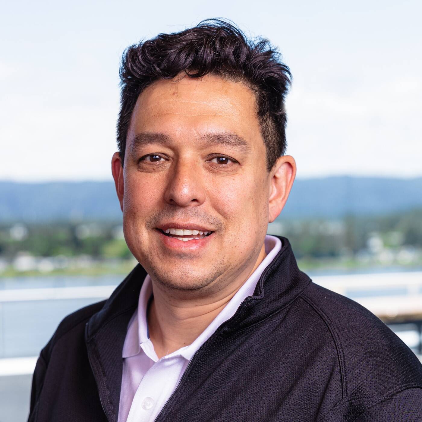 Professional portrait of Elmer Huh, Chief Investment Officer