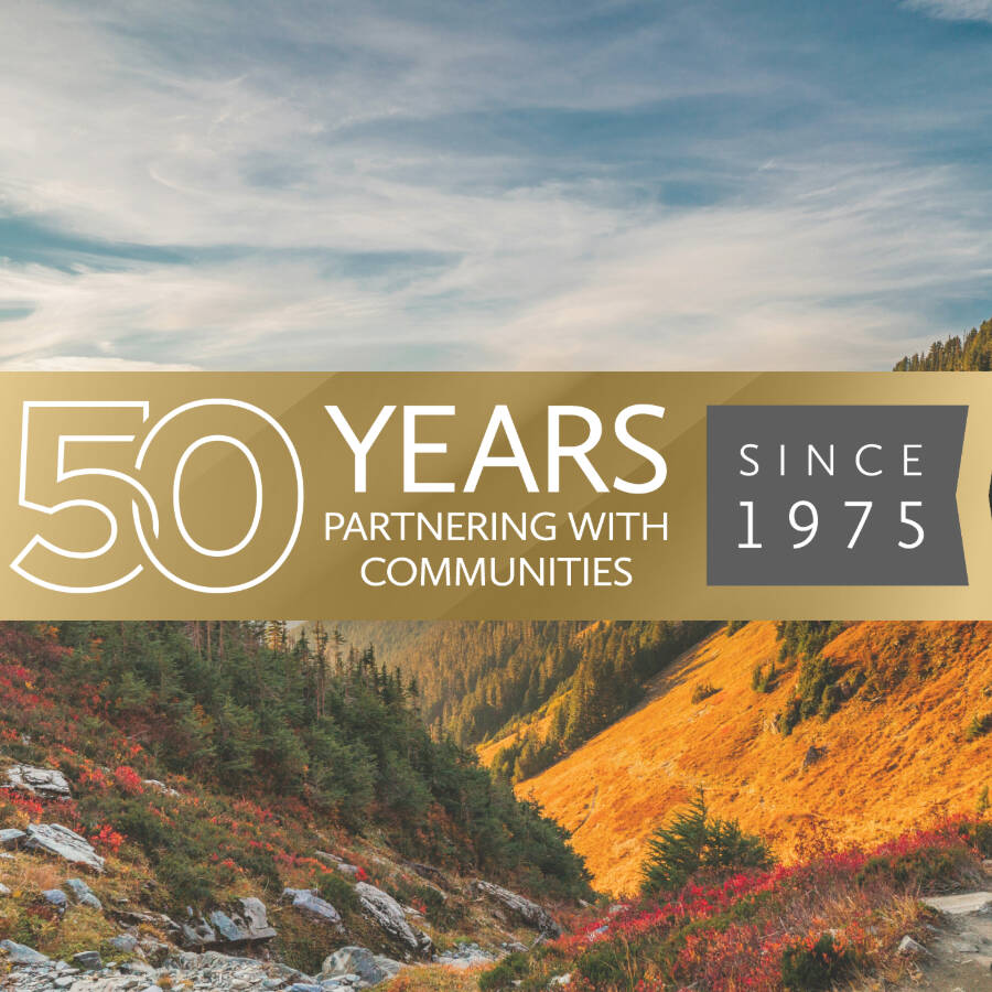 Scenic landscape with anniversary graphic banner overlayed that says, '50 years partnering with communities since 1975'.