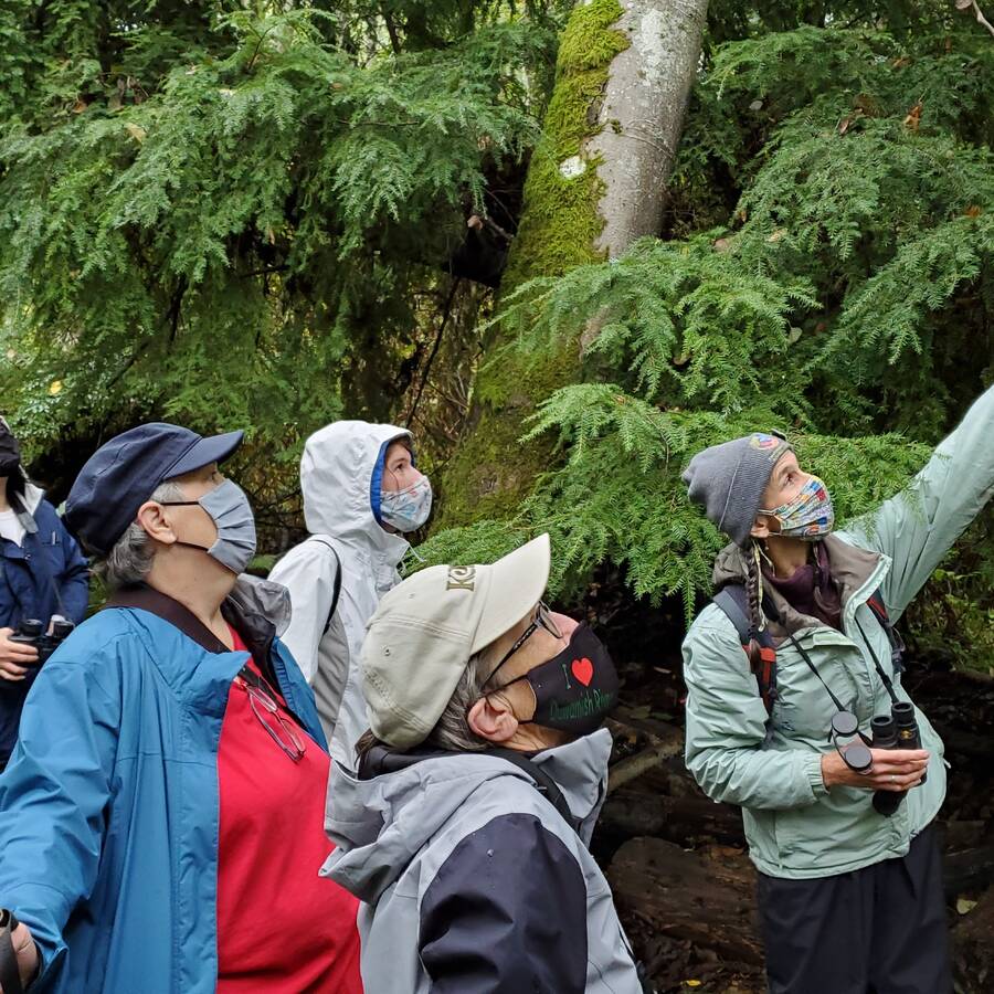 Participants on a bird walk organized by the Environmental Science Center, exploring local wildlife and learning about Washington's natural environment.