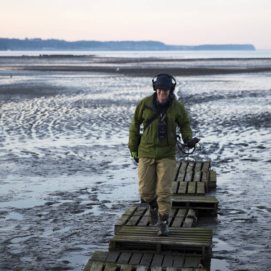 Environmental reporter at Seattle's NPR news station, KUOW, walking around Sequim Bay.
